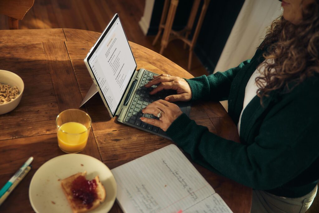 girl typing on a computer for task management and reducing the overwhelm of a to do list